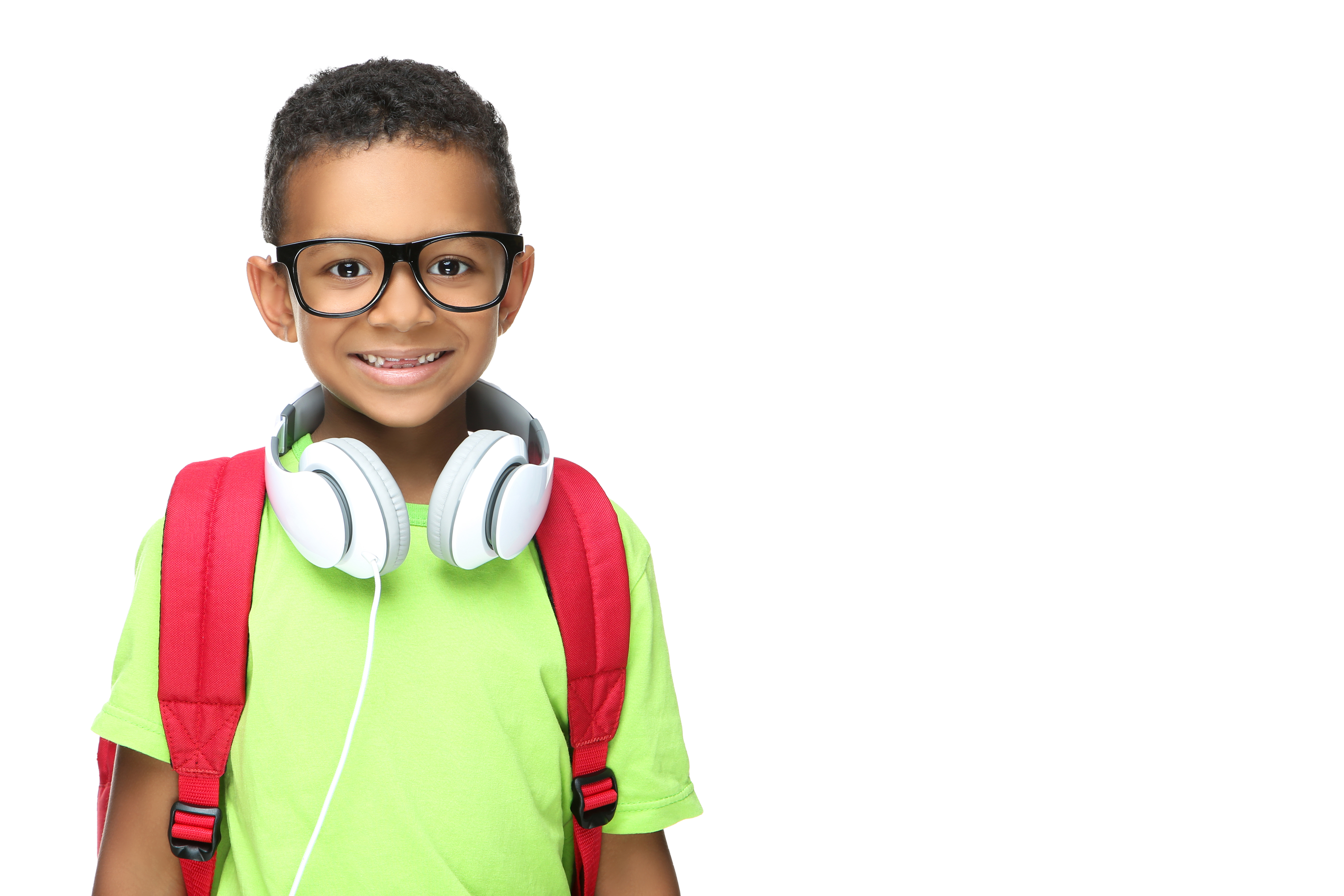 Young boy wearing backpack with arms crossed smiling