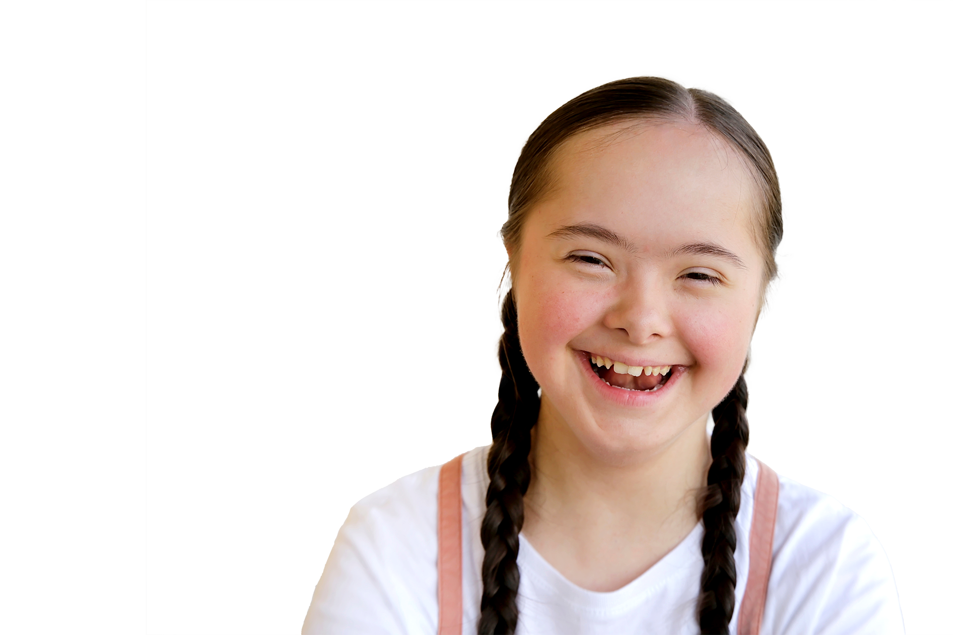 Young girl and boy students standing back to back smiling and laughing